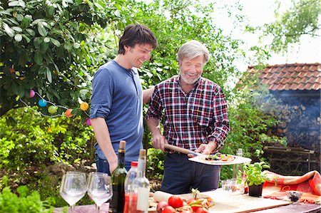 father son summer - Father and adult son making pizza Stock Photo - Premium Royalty-Free, Code: 649-07438100