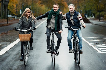 fall fun - Friends cycling on street Stock Photo - Premium Royalty-Free, Code: 649-07520107