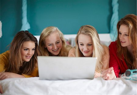 simsearch:649-07520254,k - Four teenage girls looking at laptop in bedroom Stock Photo - Premium Royalty-Free, Code: 649-07520245