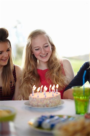 simsearch:649-07520254,k - Teenage girl with birthday cake and candles Stock Photo - Premium Royalty-Free, Code: 649-07520247