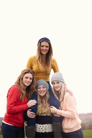 simsearch:649-07520254,k - Teenage girl getting shoulder ride from friends Stock Photo - Premium Royalty-Free, Code: 649-07520263