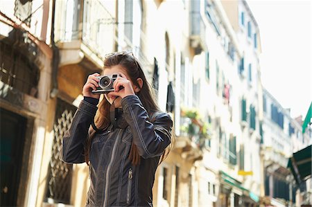 Girl taking photographs, Venice, Italy Stock Photo - Premium Royalty-Free, Code: 649-07520754