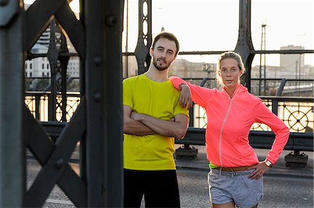 sports city images - Portrait of young running couple on bridge Stock Photo - Premium Royalty-Free, Code: 649-07520924