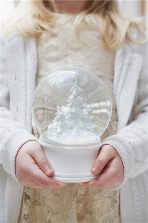 Cropped shot of young girl holding christmas snow globe Stock Photo - Premium Royalty-Free, Code: 649-07559805