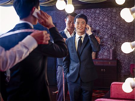 simsearch:649-07119141,k - Young man trying on suit in traditional tailors shop Stock Photo - Premium Royalty-Free, Code: 649-07559872