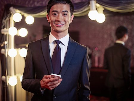 Portrait of young man in new suit in traditional tailors shop Stock Photo - Premium Royalty-Free, Code: 649-07559873
