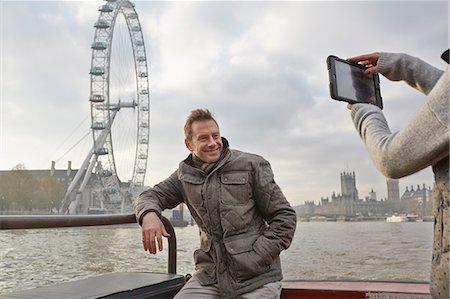 Mature tourist couple photographing selves and London Eye, London, UK Stock Photo - Premium Royalty-Free, Code: 649-07560254