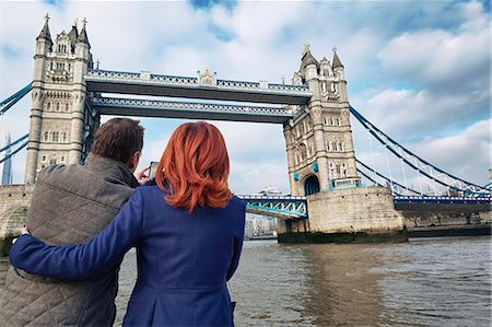 Mature tourist couple photographing Tower Bridge, London, UK Stock Photo - Premium Royalty-Free, Code: 649-07560256
