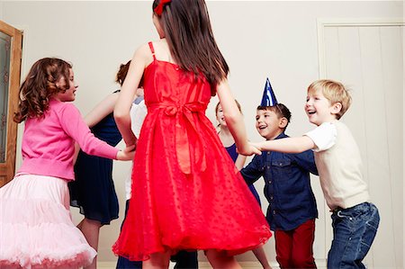 six people holding hands - Children dancing at birthday party Stock Photo - Premium Royalty-Free, Code: 649-07560314