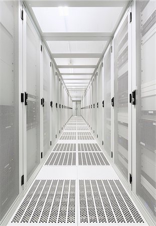 Data storage corridor in data warehouse Stock Photo - Premium Royalty-Free, Code: 649-07560331