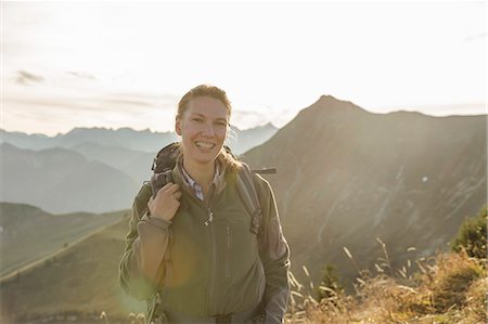 Portrait of a mid adult woman backpacker, Achensee, Tyrol, Austria Stock Photo - Premium Royalty-Free, Code: 649-07560389