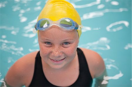 swimwear indoors - Portrait of schoolgirl swimmer in pool Stock Photo - Premium Royalty-Free, Code: 649-07585403