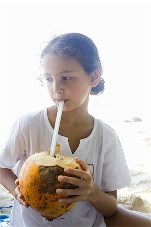 simsearch:649-07585546,k - Girl drinking from a coconut Stock Photo - Premium Royalty-Free, Code: 649-07585554