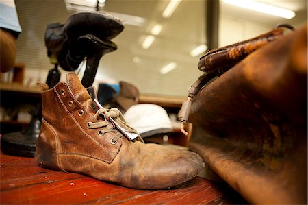 small business man not looking at camera - Close up of leather boot and bag Stock Photo - Premium Royalty-Free, Code: 649-07596263