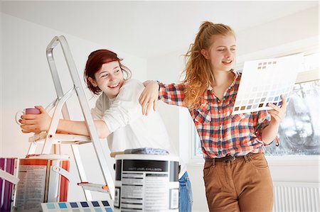step ladder - Two teenage sisters preparing to decorate bedroom Stock Photo - Premium Royalty-Free, Code: 649-07596474