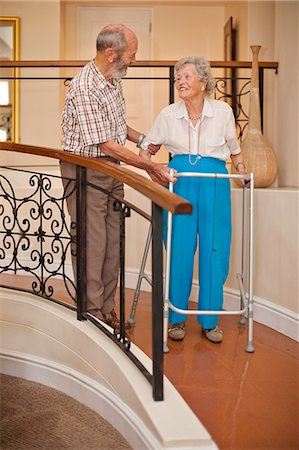 Senior couple in hallway of retirement villa Stock Photo - Premium Royalty-Free, Code: 649-07596673