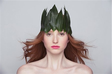 Young woman wearing crown of leaves Stock Photo - Premium Royalty-Free, Code: 649-07647905