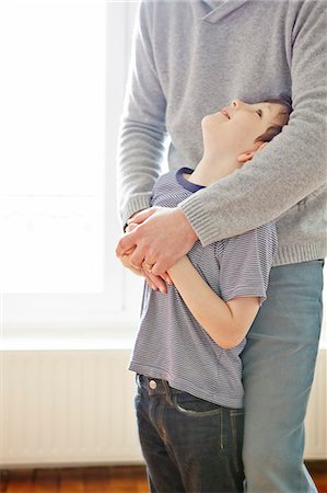 safety family - Boy showing affection to father Stock Photo - Premium Royalty-Free, Code: 649-07648105