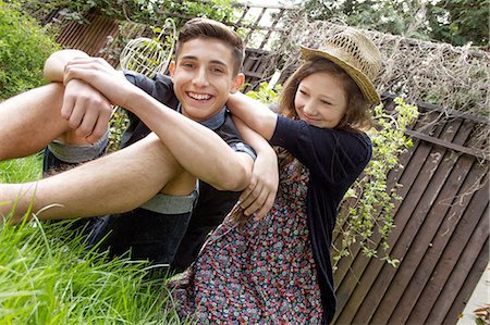simsearch:649-07648247,k - Teenage couple relaxing in garden Stock Photo - Premium Royalty-Free, Code: 649-07648244