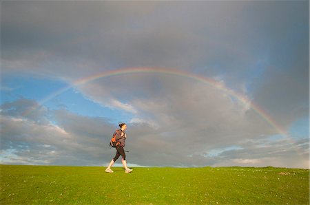 Young female hiker, hiking below rainbow Stockbilder - Premium RF Lizenzfrei, Bildnummer: 649-07648259