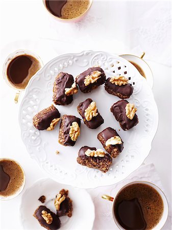 Still life of chocolate and walnut macadamia cakes Stock Photo - Premium Royalty-Free, Code: 649-07710541