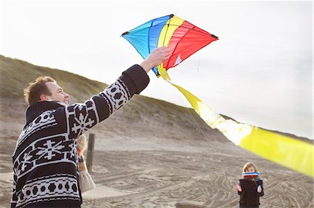 parent child kite - Mid adult man and son preparing to fly kite on beach, Bloemendaal aan Zee, Netherlands Stock Photo - Premium Royalty-Free, Code: 649-07710719