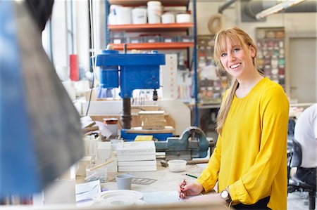 Female potter working in ceramic workshop Stock Photo - Premium Royalty-Free, Code: 649-07736604