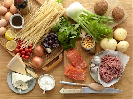 simsearch:400-06864386,k - Selection of fresh raw foods with eggs, pasta, herbs, cheese, vegetables, salmon and minced pork Stock Photo - Premium Royalty-Free, Code: 649-07736766