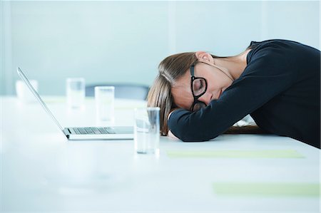 Female office worker asleep at conference table Stock Photo - Premium Royalty-Free, Code: 649-07736830