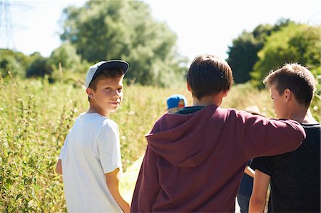 Portrait of boy wearing cap with friends Stock Photo - Premium Royalty-Free, Code: 649-07760848