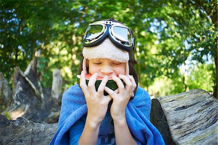 energy consumption - Young boy in fancy dress, eating watermelon in the park Stock Photo - Premium Royalty-Free, Code: 649-07760857