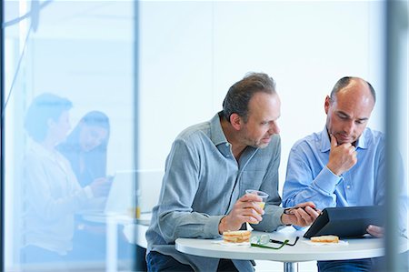 Business people having discussion over lunch Stock Photo - Premium Royalty-Free, Code: 649-07761016