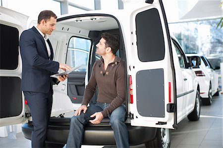 Indecisive customer and salesman in car dealership Stock Photo - Premium Royalty-Free, Code: 649-07761167