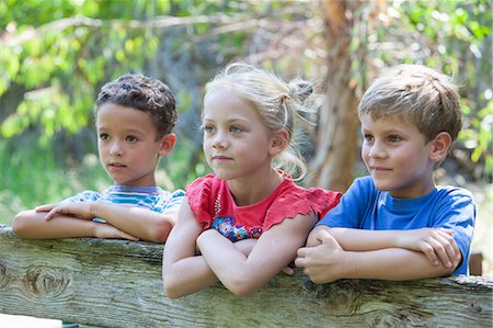 simsearch:649-07804176,k - Three children leaning on fence looking away Stock Photo - Premium Royalty-Free, Code: 649-07804148