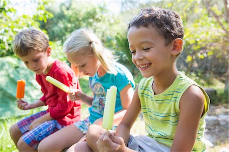 simsearch:649-07804176,k - Three children in garden eating ice lollies Stock Photo - Premium Royalty-Free, Code: 649-07804154