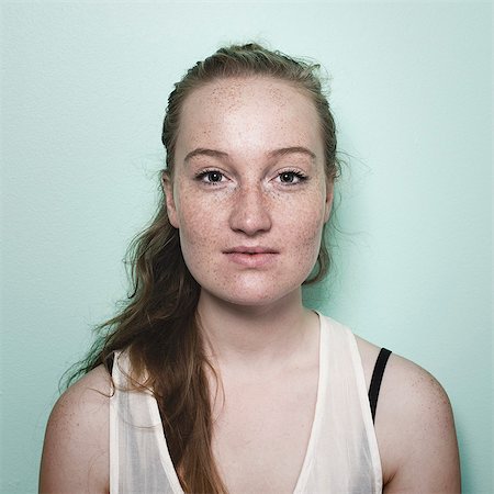 Portrait of young woman with freckles Stock Photo - Premium Royalty-Free, Code: 649-07804764