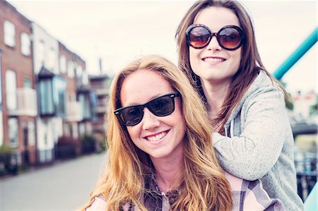 simsearch:649-07736862,k - Portrait of two young female best friends in sunglasses Stock Photo - Premium Royalty-Free, Code: 649-07804825