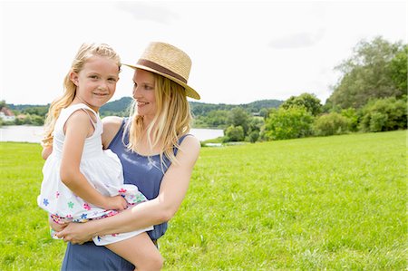 simsearch:649-07805043,k - Mother holding daughter in field, portrait Stock Photo - Premium Royalty-Free, Code: 649-07805071