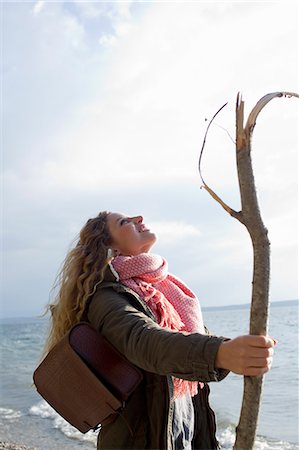 simsearch:649-07437432,k - Woman by the sea with a large stick Stock Photo - Premium Royalty-Free, Code: 649-07803511