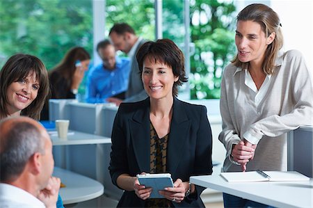 simsearch:649-07736470,k - Business colleagues having informal meeting in office Stock Photo - Premium Royalty-Free, Code: 649-07803594