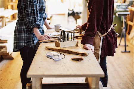 simsearch:649-07710266,k - Cropped view of two craftswomen at workbench in pipe organ workshop Stock Photo - Premium Royalty-Free, Code: 649-07905027