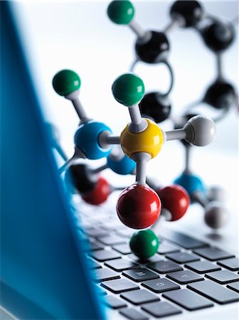 Close up of molecular model sitting on top of lap top computer keyboard to illustrate science education and computer aided research Stock Photo - Premium Royalty-Free, Code: 649-07905105