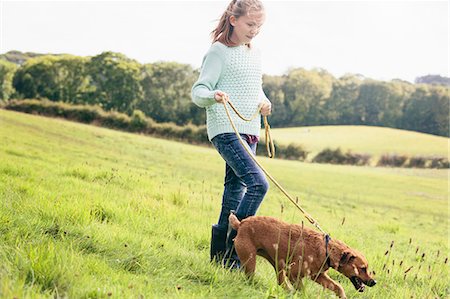 dog leash girl - Girl walking dog Stock Photo - Premium Royalty-Free, Code: 649-07905762