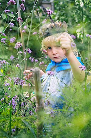 simsearch:695-05768235,k - Boy dressed up and playing with plants in garden Stock Photo - Premium Royalty-Free, Code: 649-08004276