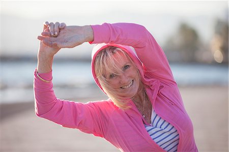simsearch:649-07760822,k - Senior woman stretching by beach Stock Photo - Premium Royalty-Free, Code: 649-08060114
