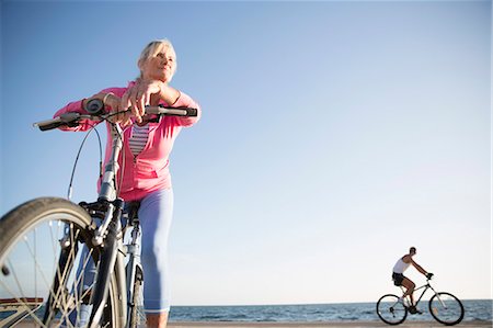 simsearch:649-07760822,k - Senior woman on bicycle by beach Stock Photo - Premium Royalty-Free, Code: 649-08060120