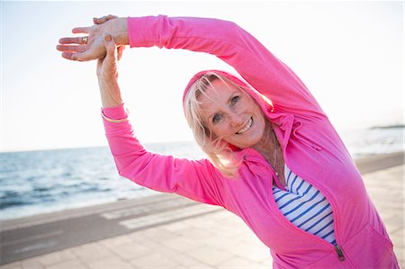 simsearch:649-07760822,k - Senior woman stretching by beach Stock Photo - Premium Royalty-Free, Code: 649-08060122