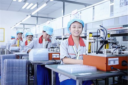 Workers at e-cigarettes battery factory, Guangdong, China Stock Photo - Premium Royalty-Free, Code: 649-08084825