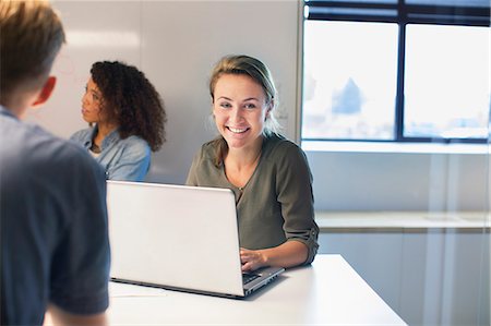 person organizing desk - Over shoulder of woman at meeting Stock Photo - Premium Royalty-Free, Code: 649-08084951