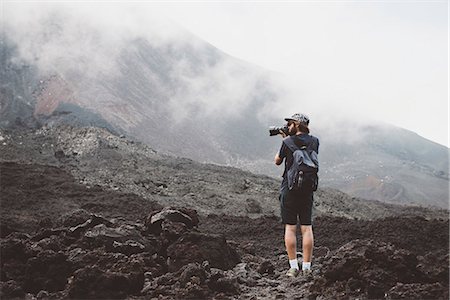 simsearch:649-08086253,k - Young man photographing the Pacaya volcano, Antigua, Guatemala Stock Photo - Premium Royalty-Free, Code: 649-08085501